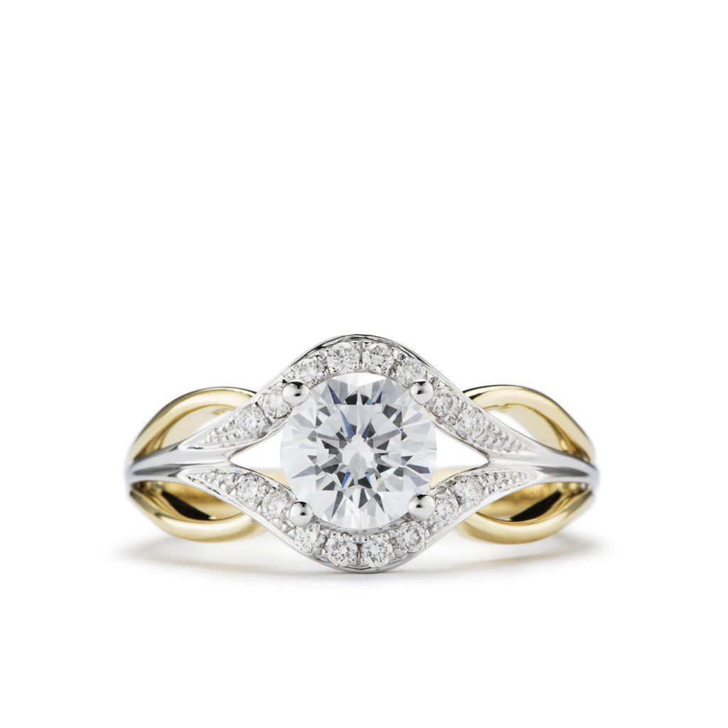 Two-tone diamond engagement ring with split shank and diamond accents 