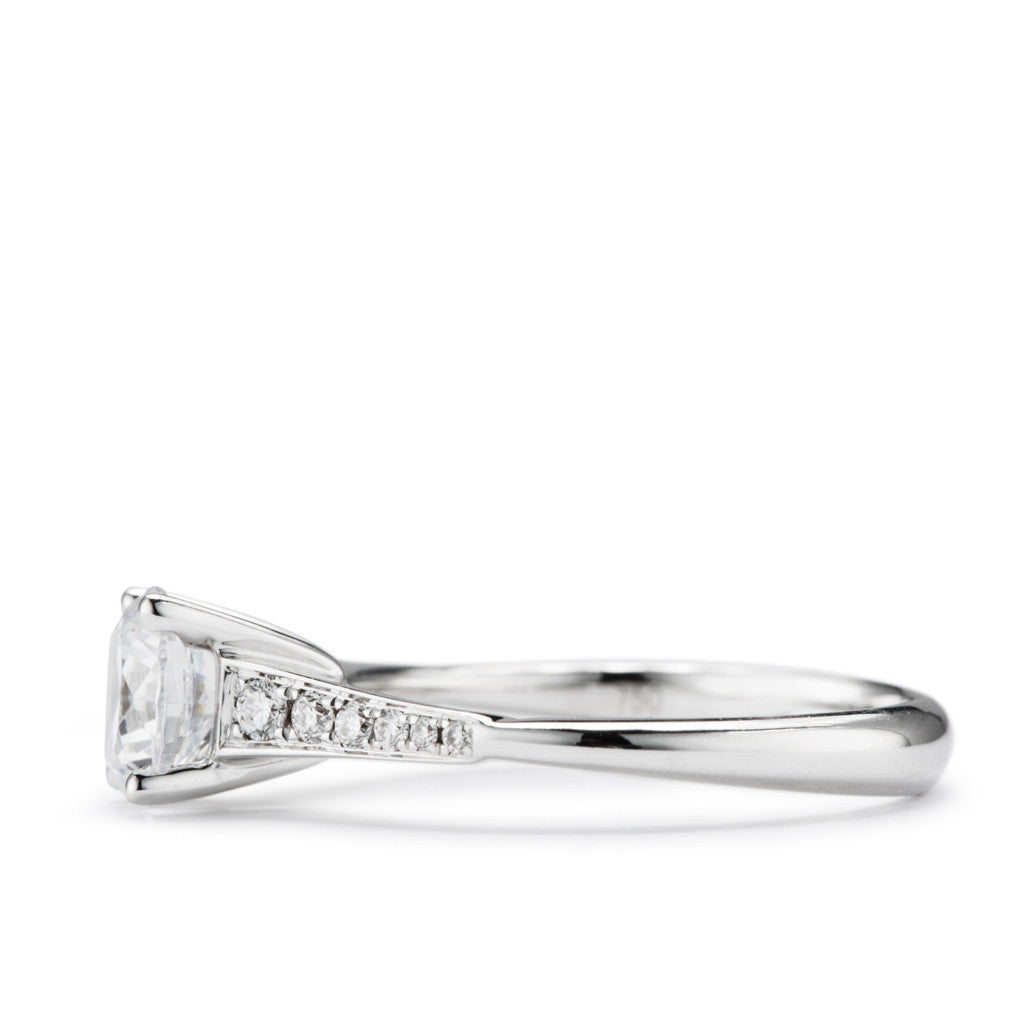 Cathedral Solitaire engagement ring with diamond set sides