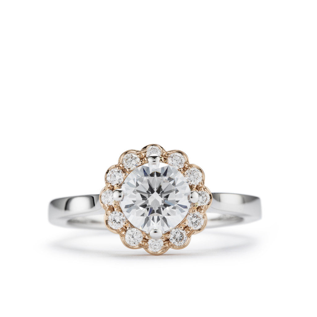 'Daisy' two tone diamond halo engagement ring.