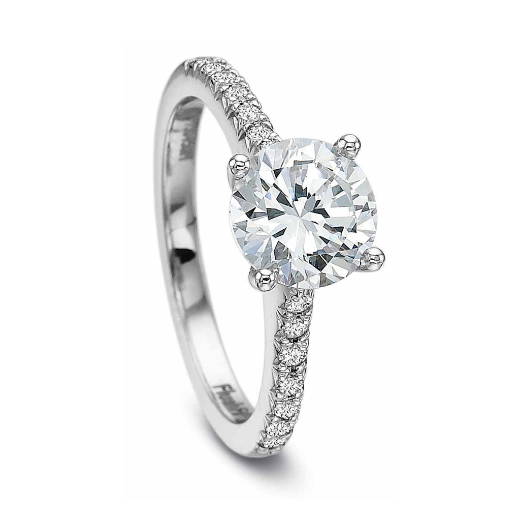 Diamond solitaire engagement ring with diamond shoulders