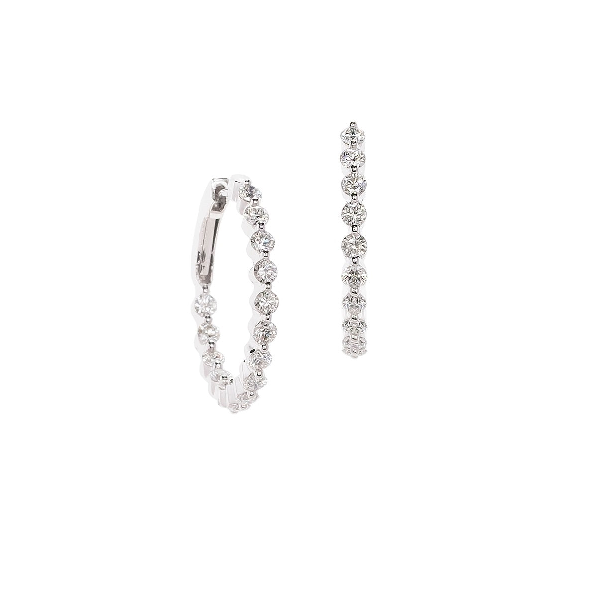 Diamond 'in and out' hoop earrings in white gold. 