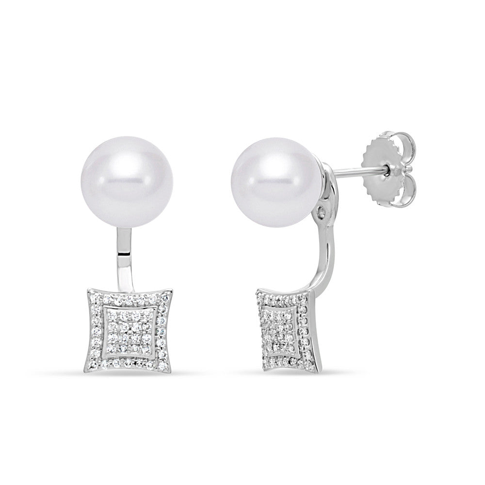 Unique pearl stud earrings with dramatic diamond accent drop. 