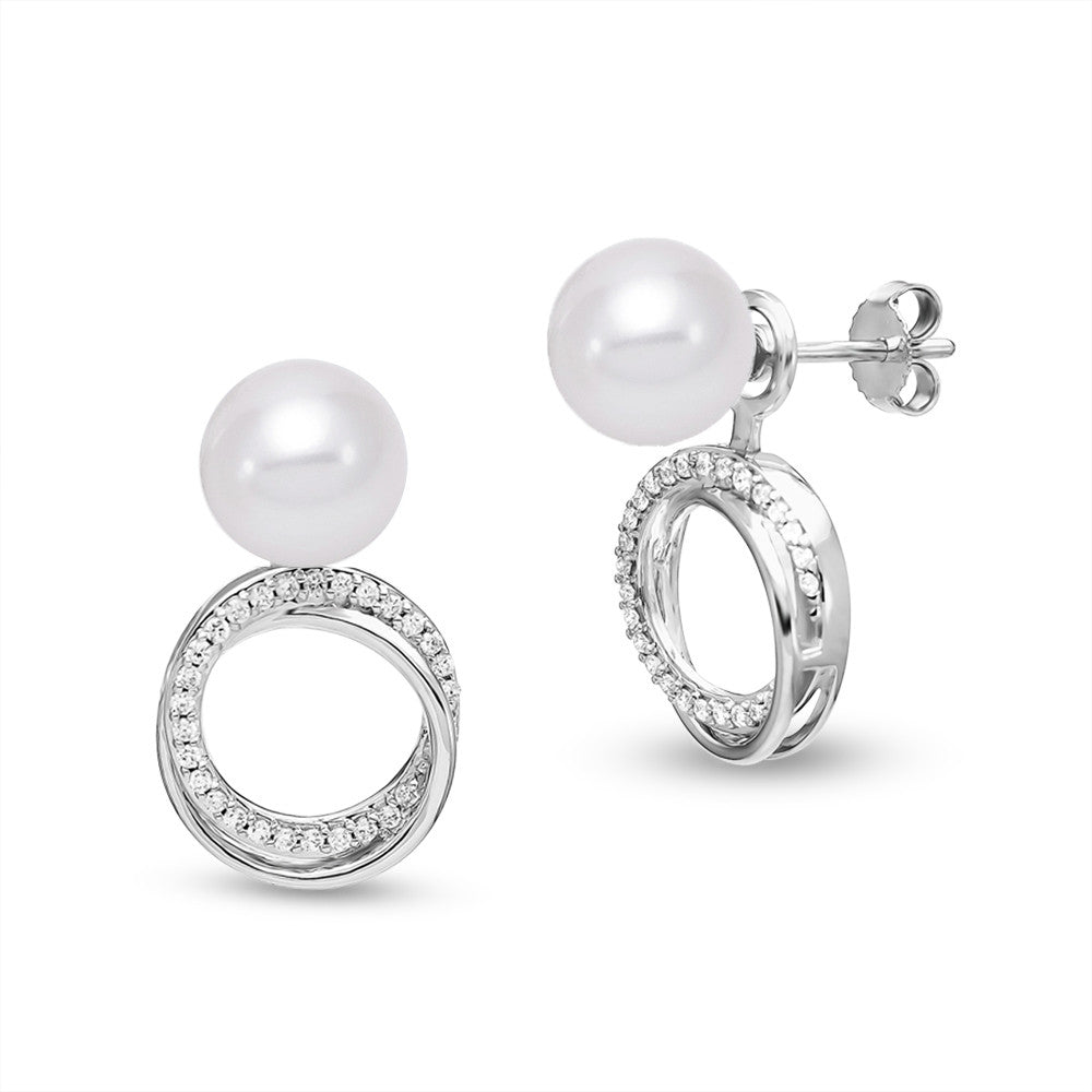A quick twist makes these white gold and pearl studs into a clever drop. 