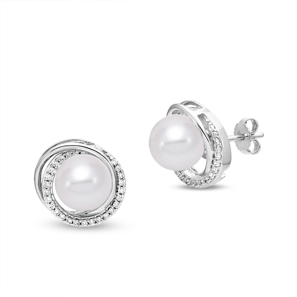 Convertible Pearl Earrings in 18k White Gold with diamond accents. The white gold swirl around the pearl converts to a dramatic drop beneath the classic pearl stud. 