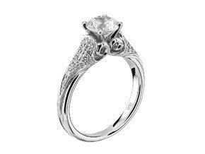 White gold and diamond Cathedral style solitaire engagement ring