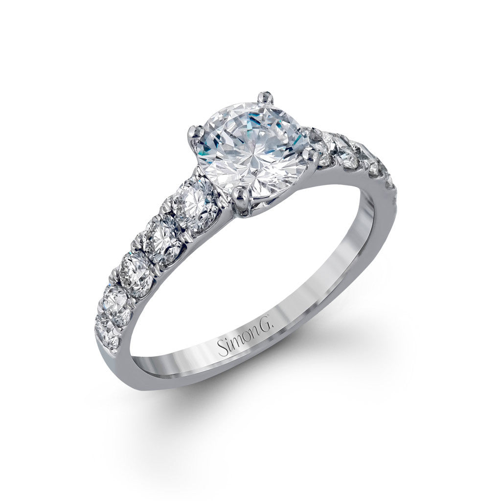 Solitaire Engagement Ring with Diamond Shoulders. 