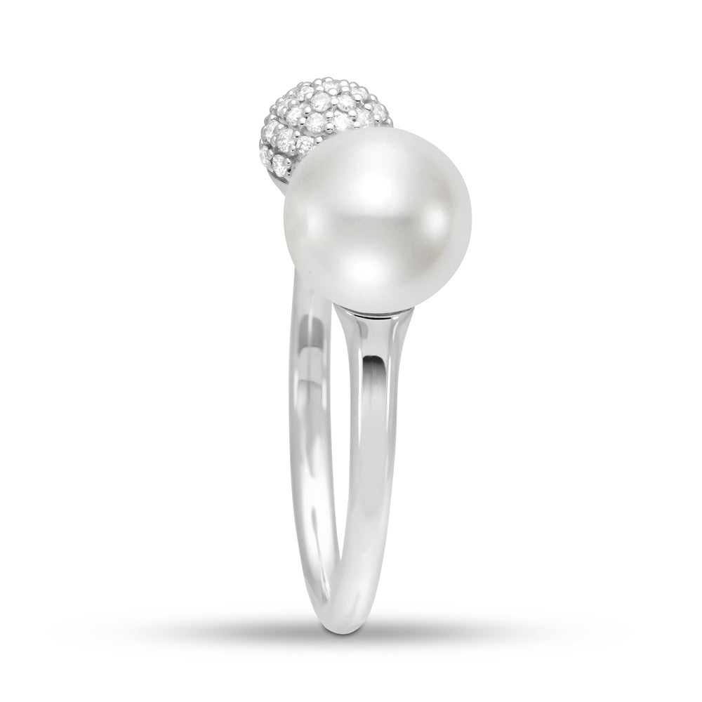 A modern white gold ring with pearl and diamond pave' detail. 